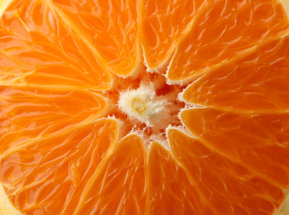 Ripe sweet mandarin on whole background, macro