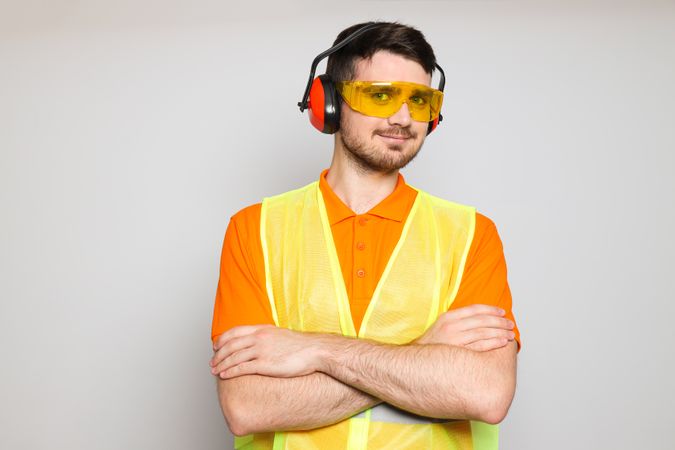 Young man civil engineer in ear protectors