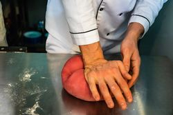 Person making pasta dough