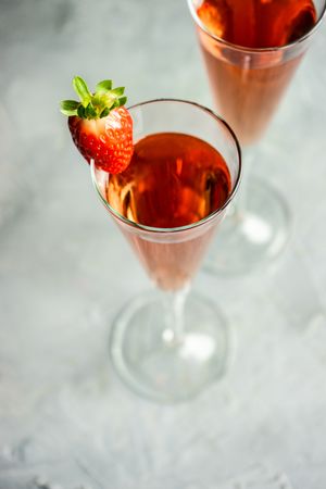 Pink champagne with strawberry slice