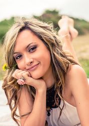 Romantic woman resting in the hand lying down outdoors