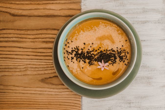 Tasty soup puree with seeds in bowl