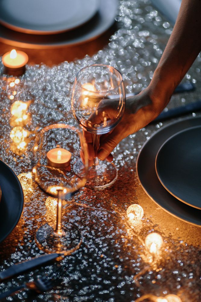 Wine glasses being set for dinner