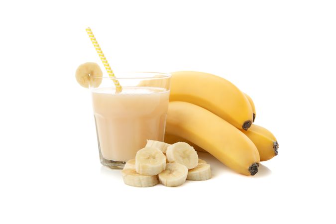 Banana juice isolated on blank background. Fresh fruit