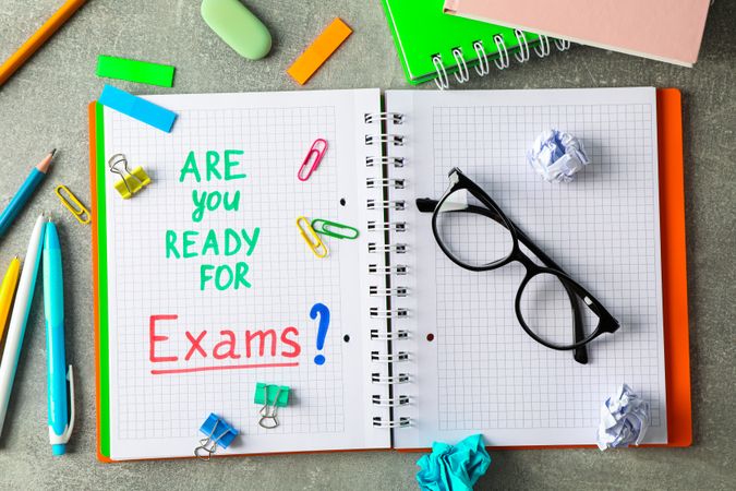 Composition with school supplies on grey background, top view