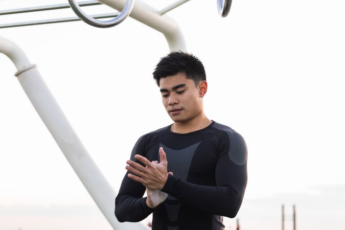 Athletic man with powdered hands