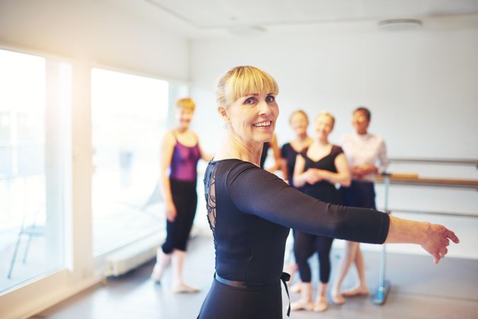 Portrait of smiling mature woman at ballet class