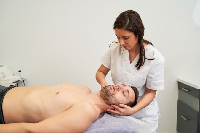 a man being treated for a spinal cord injury at the physiotherap