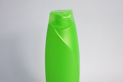 Green mockup shampoo or body wash bottle with copy space