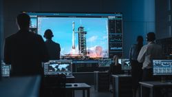 Mission Control Monitors Rocket Launch on Large Screens.