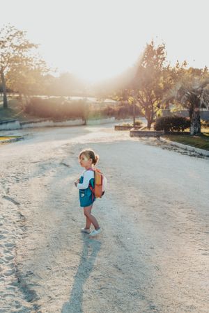Little girl standing in park