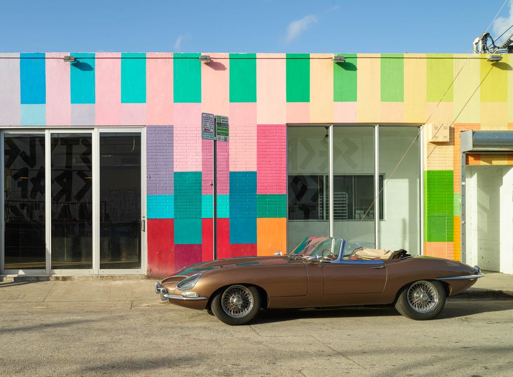 Colorful painted building and convertible in Miami