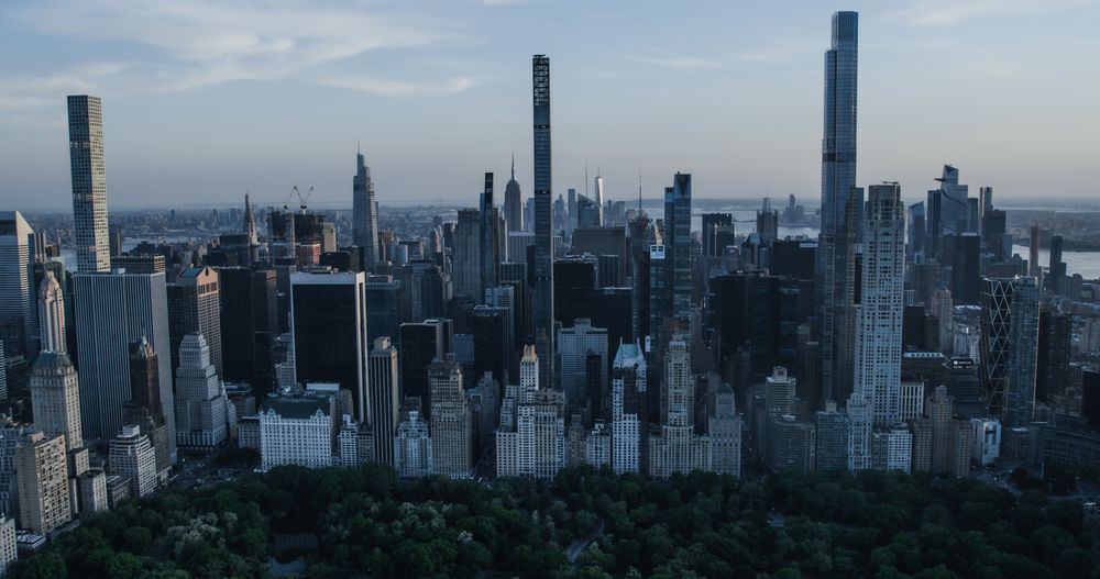 Scenic Aerial New York City View From Midtown Towards Lower Manhattan Architecture. Panoramic Wall Street Financial District Shot from a Helicopter. Cityscape with Office Buildings and Skyscrapers