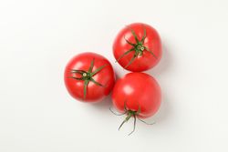 Fresh ripe tomatoes on light background, top view