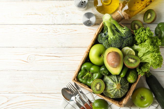 Concept of healthy food with vegetables and fruits on wooden table