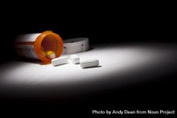 Medicine Bottle and Pills Under Spot Light 4MGnzk