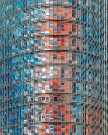 high rise glass building with reflection on it