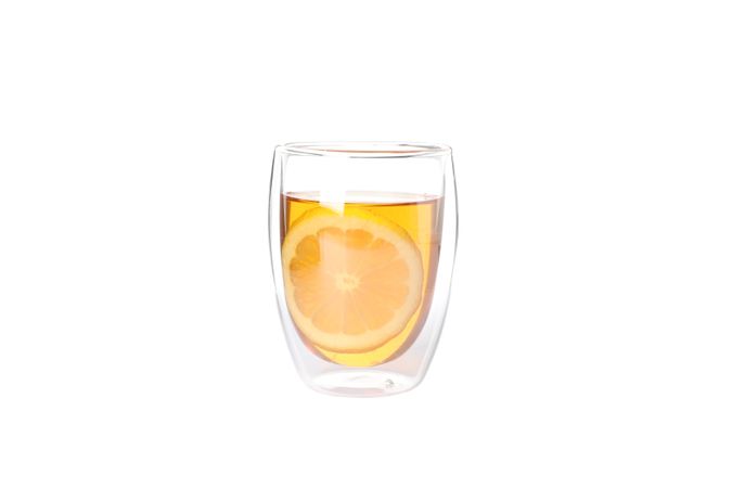Glass with lemon slice and tea isolated on plain background