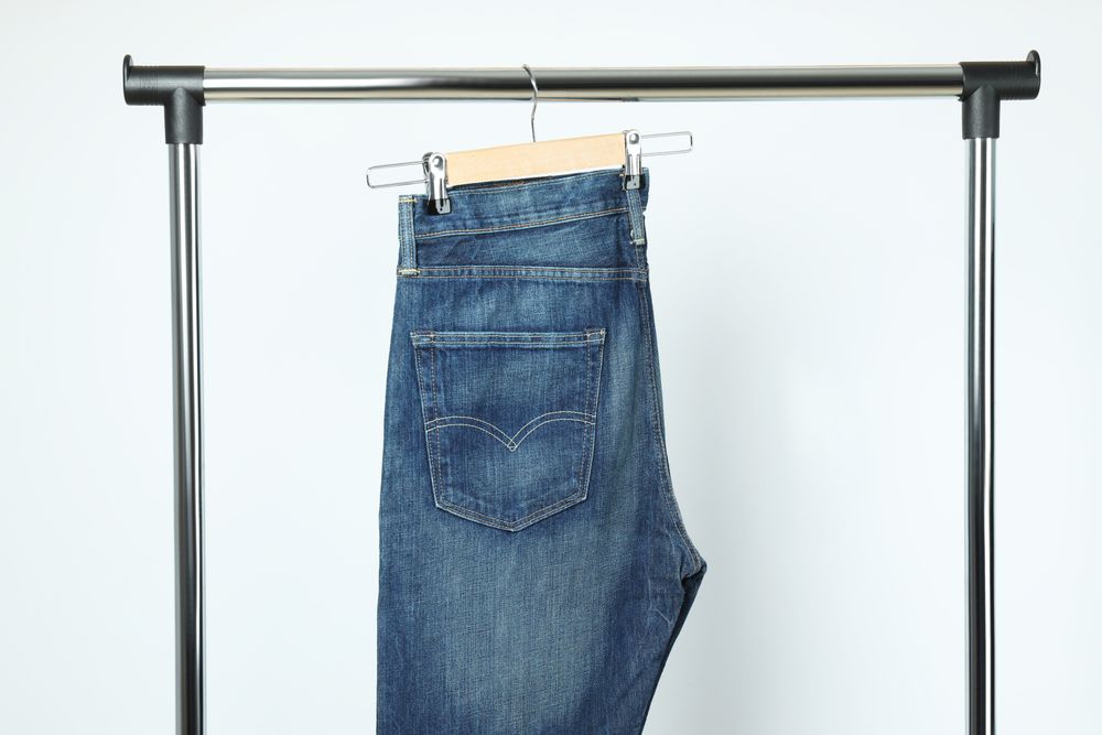Jeans hang on hangers