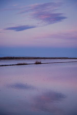 Sunset sky reflecting in calm water
