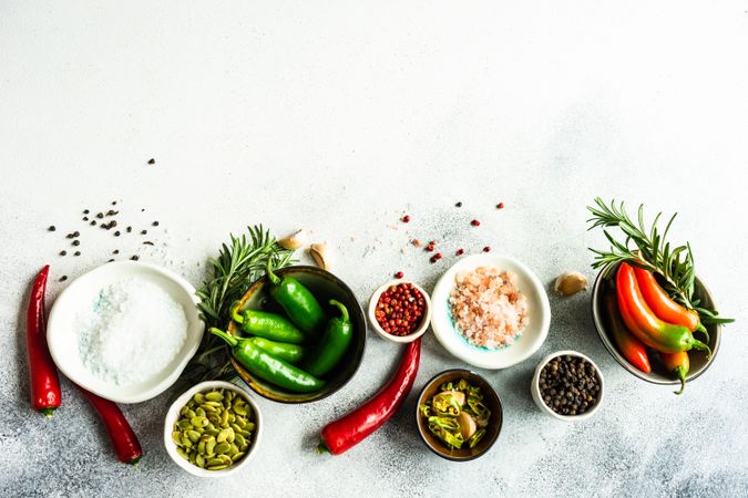 Fresh ingredients and seasonings on marble counter