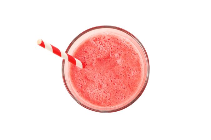 Glass of watermelon juice isolated on plain background. Fresh drink