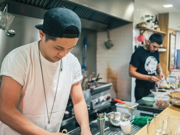Young males working in kitchen