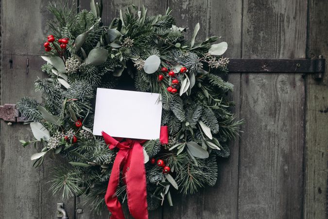 Christmas advent wreath, garland of fir, pine tree branches and red berries