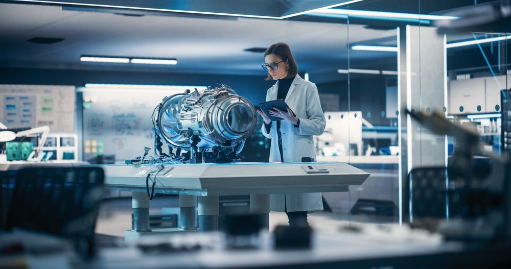 Female Scientist Developing New Electric Motor in Advanced Research Facility