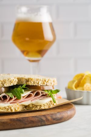 Delicious sandwich with ham, cheese, lettuce and tomato