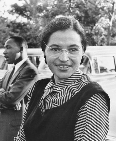 Rosa Parks with Dr. Martin Luther King jr in the background