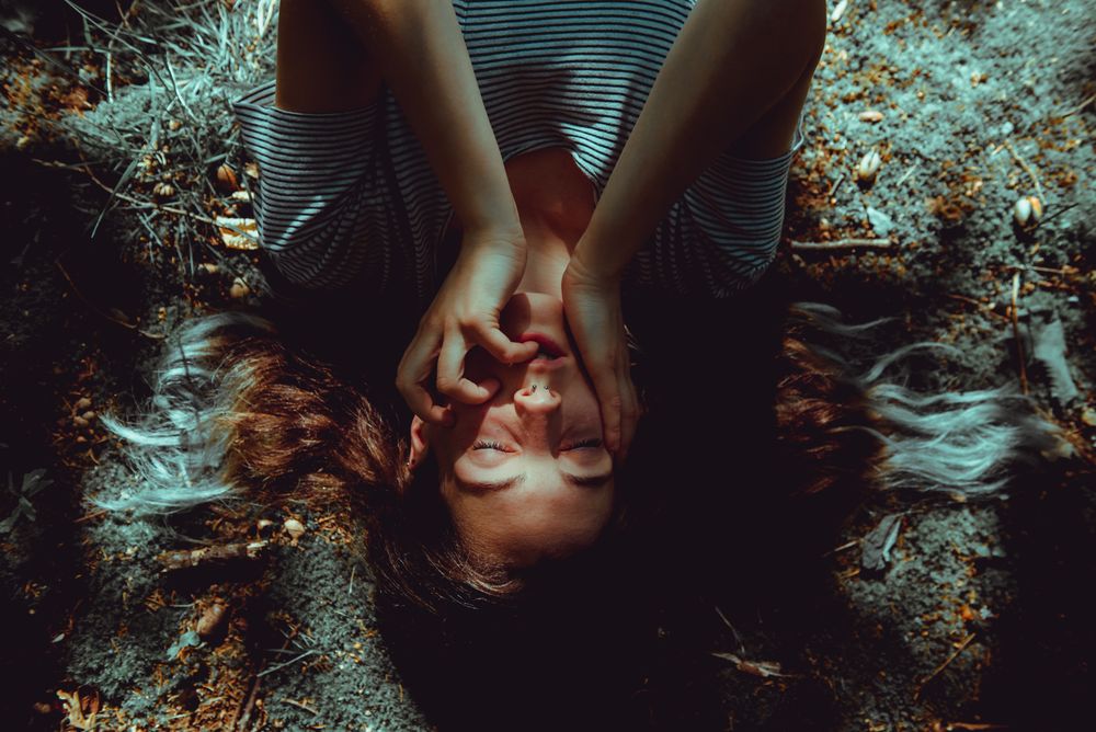 Woman lying on ground