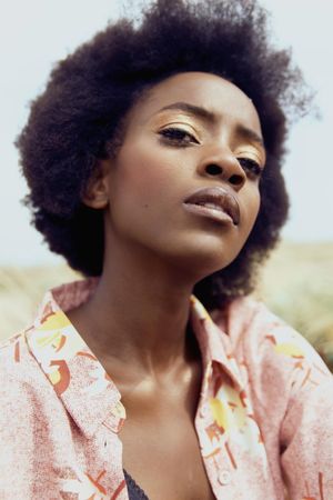 Portrait of Black woman in floral top