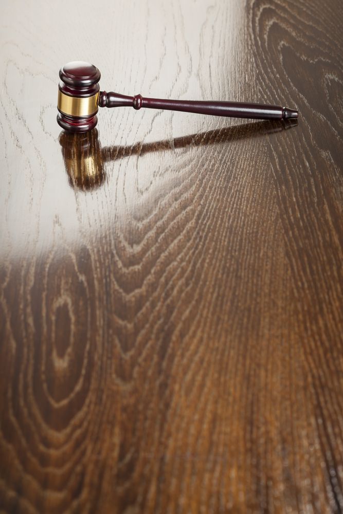 Wooden Gavel Abstract on Reflective Table