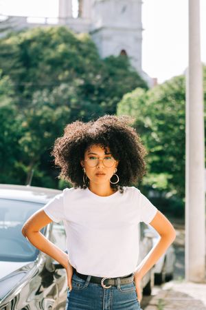 Black female standing on street