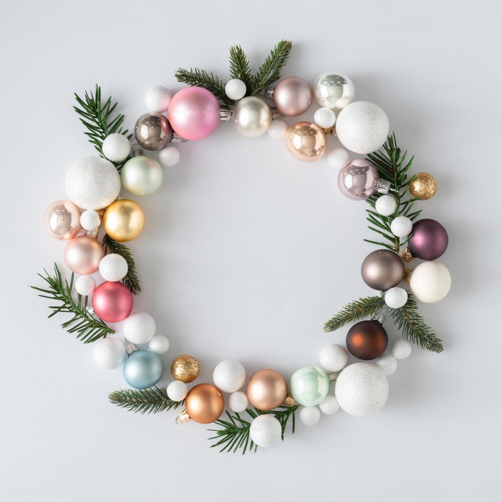 Christmas wreath made of decorative baubles and branches