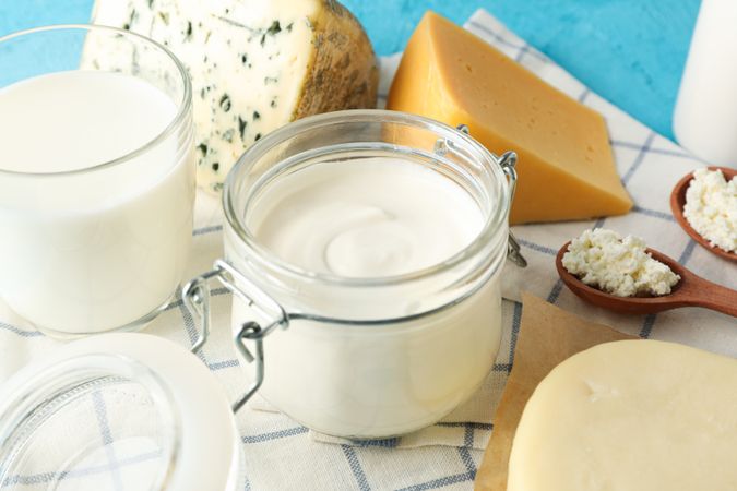 Fresh dairy products on kitchen towel, close up