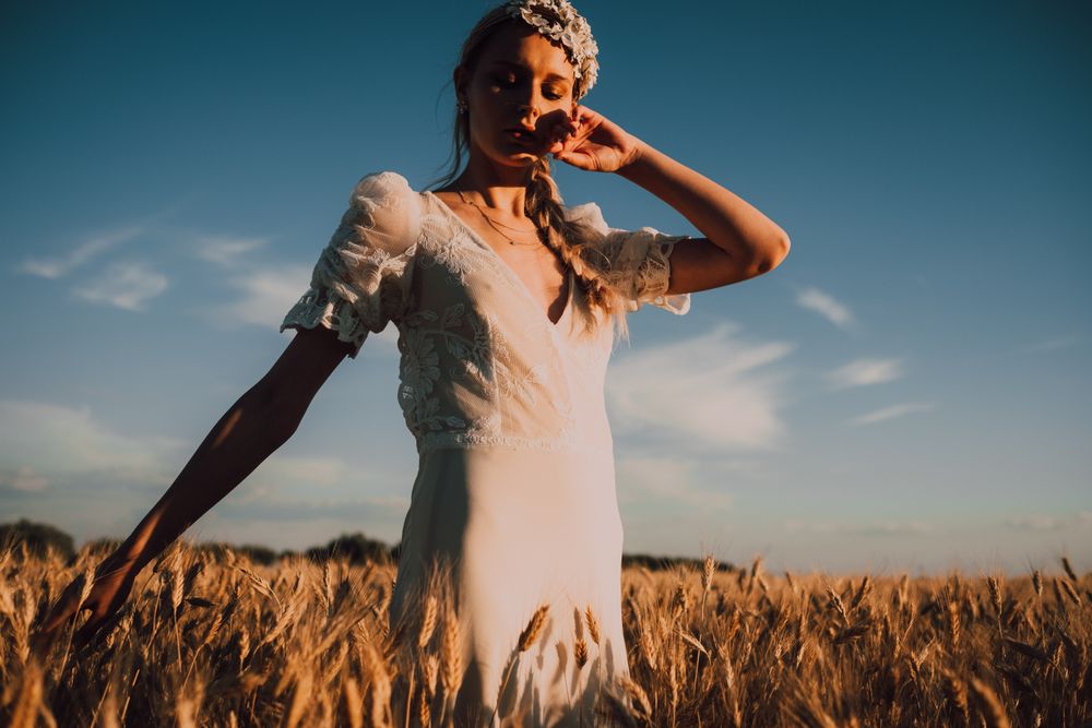 Woman in middle of wheat field