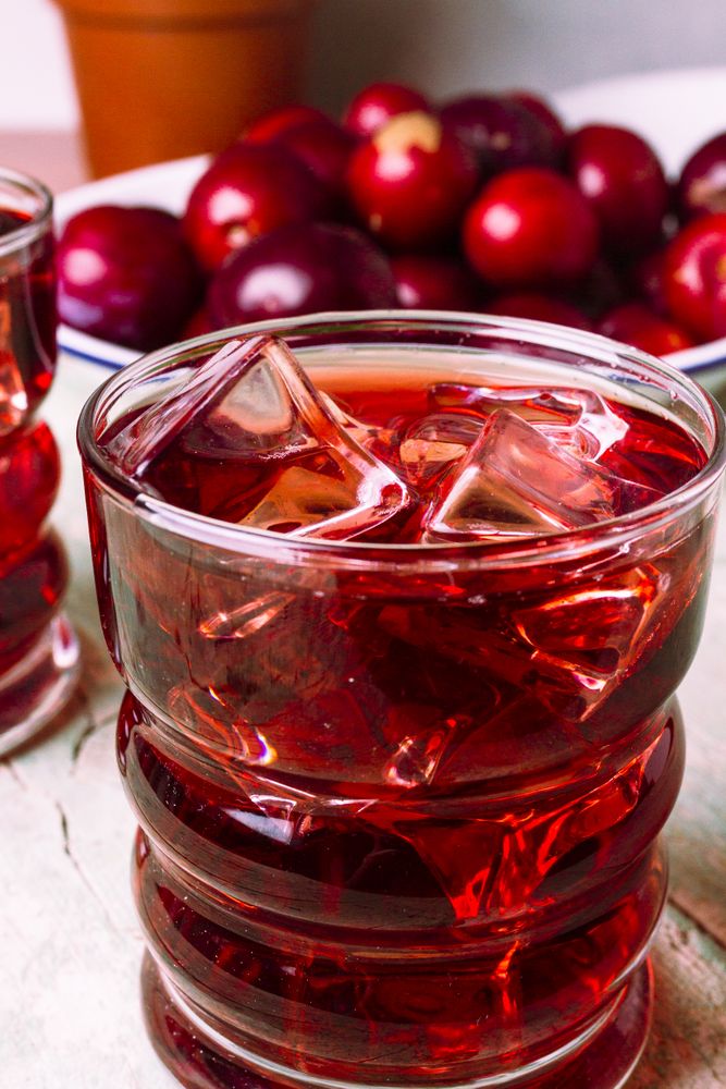 Red drink near fresh fruits