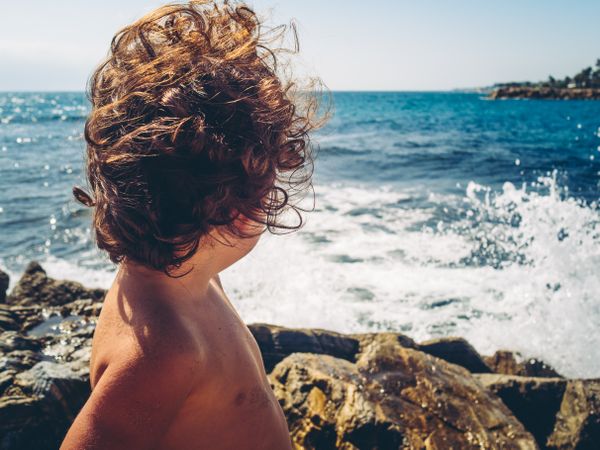 anonymous little girl by the beach