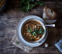 Bread and parsley near quinoa soup