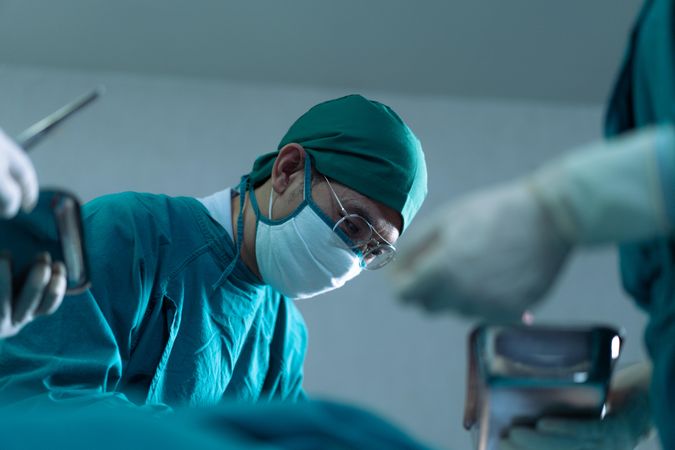 Group of doctors working in operating theater