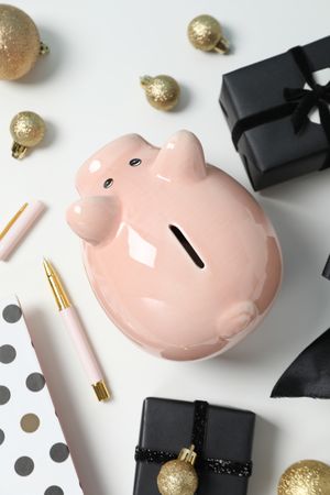 Concept of Christmas finance with piggy bank, top view