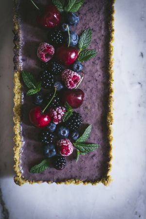 Fresh blueberry pistachio cake with whole berries on top