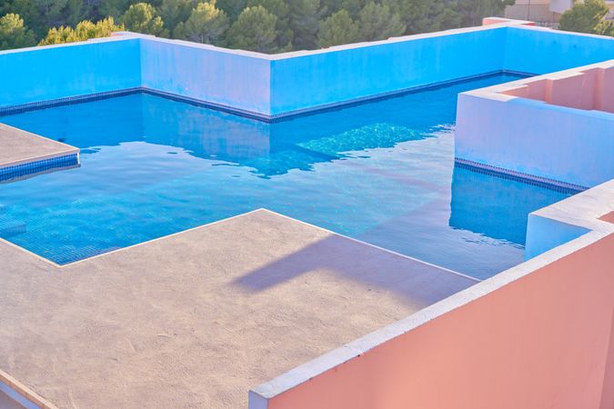 Pool on roof of building with complex geometric shapes