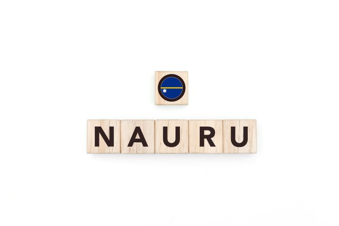Wooden blocks bearing the name and flag of Nauru.