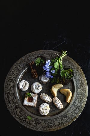 Traditional tea with mint and assorted Arab sweets
