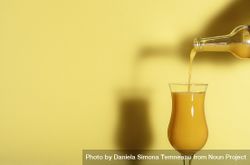Pouring orange juice in a glass 56k9l4