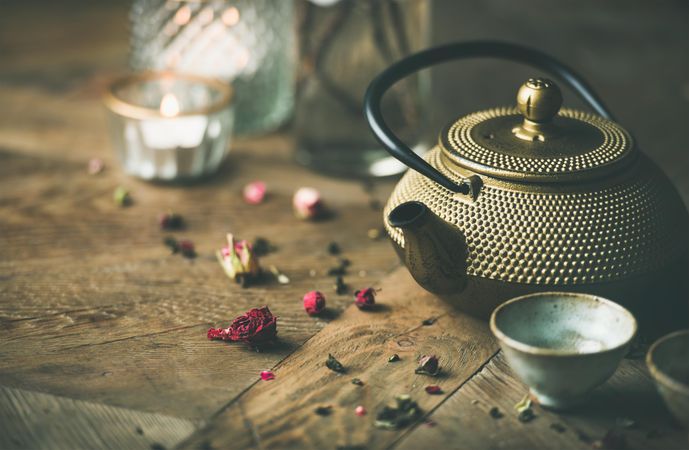 Beautiful oriental teapot on wooden table
