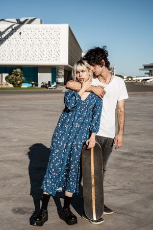 Couple standing near modern building